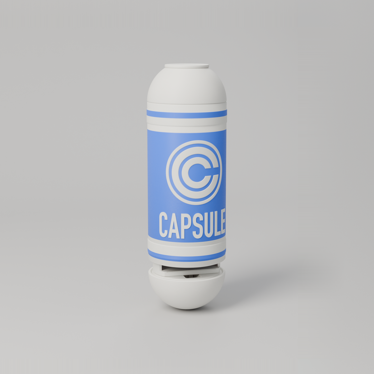 Push-button capsule fidget case in blue and white with the Capsule logo inlaid, standing upright with the bottom drawer popped open after pressing the button